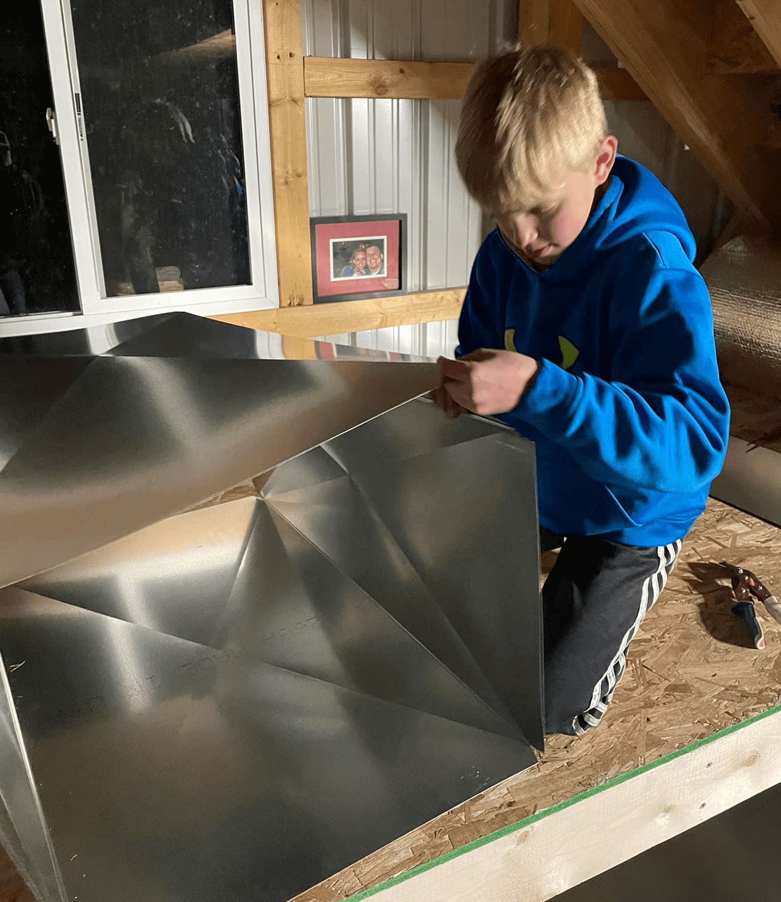 Cameron Fields pulls the pieces together when helping his Dad build a plenum for a wood stove coil